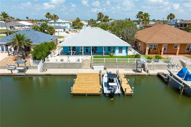 1025 Pompano Dr, Aransas Pass, TX 78336 - dock area featuring a water view, a fenced backyard, and a residential view