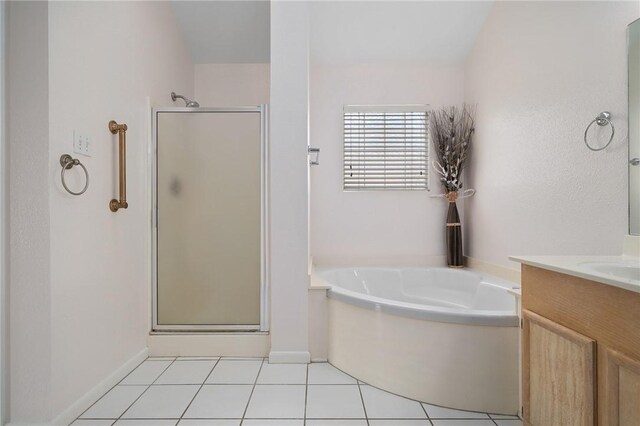 1025 Pompano Dr, Aransas Pass, TX 78336 - full bathroom with a stall shower, vanity, a bath, and tile patterned floors