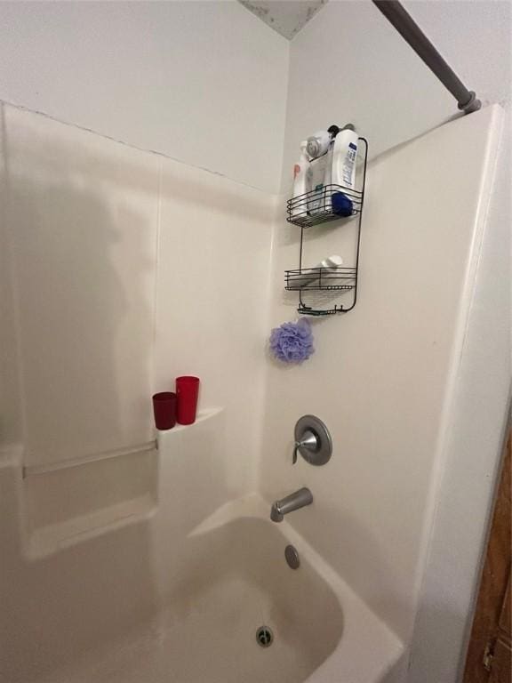 bathroom with shower / washtub combination