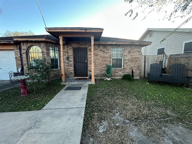 view of front of house with a front lawn and a garage