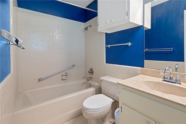full bathroom with tile patterned floors, toilet, tile walls, bathtub / shower combination, and vanity