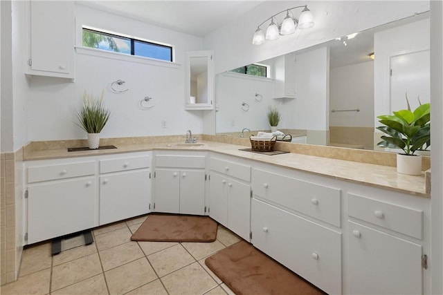 bathroom with tile patterned flooring and vanity