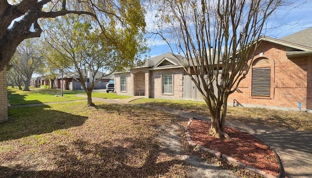 view of side of home featuring a lawn