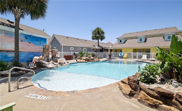 view of swimming pool featuring a patio and pool water feature