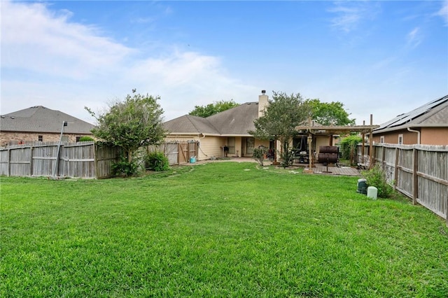 6814 Boardwalk Ave, Corpus Christi, TX 78414 - back of house with a yard, a chimney, a patio area, and a fenced backyard