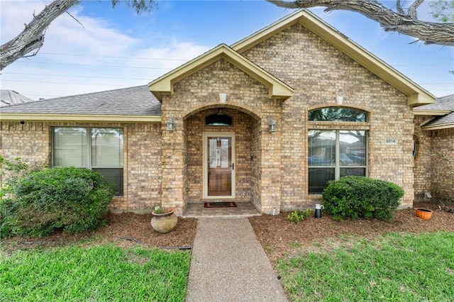 6814 Boardwalk Ave, Corpus Christi, TX 78414 - doorway to property with a shingled roof and brick siding