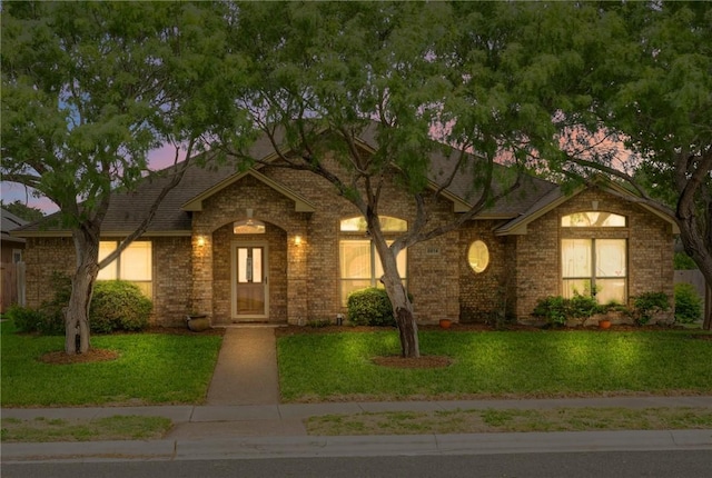 6814 Boardwalk Ave, Corpus Christi, TX 78414 - ranch-style home featuring a yard and brick siding