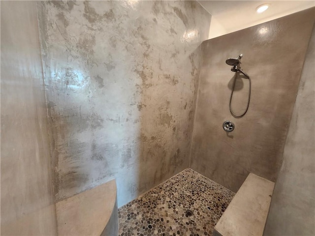 full bathroom featuring tiled shower