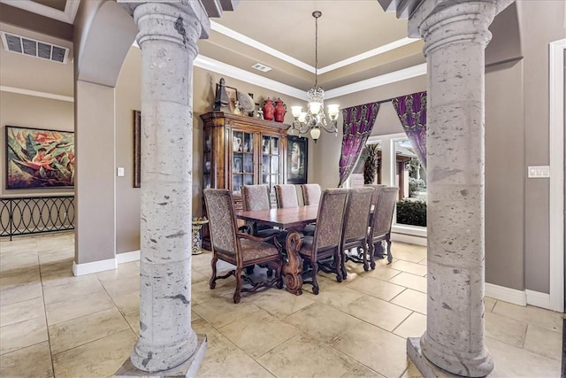 dining area featuring visible vents, an inviting chandelier, ornamental molding, and ornate columns