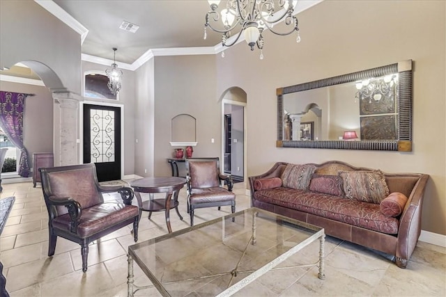 living area with baseboards, arched walkways, a notable chandelier, and crown molding