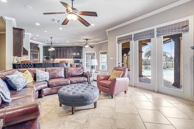 living room featuring recessed lighting, visible vents, ceiling fan, and crown molding