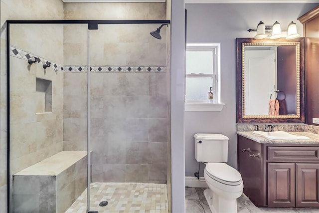 bathroom with toilet, a stall shower, and vanity