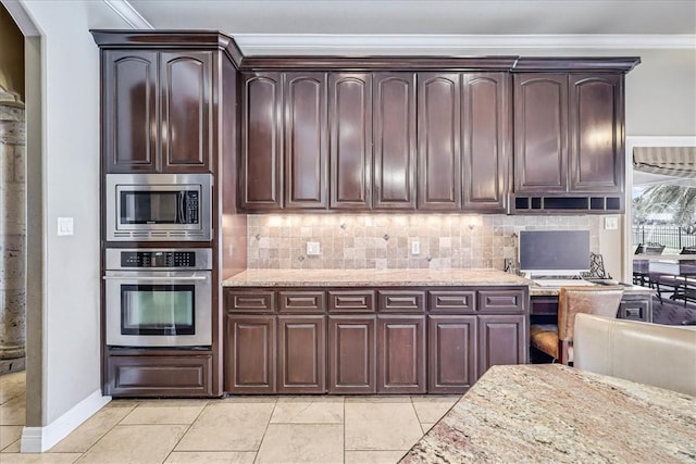 kitchen with tasteful backsplash, dark brown cabinets, crown molding, light stone counters, and stainless steel appliances