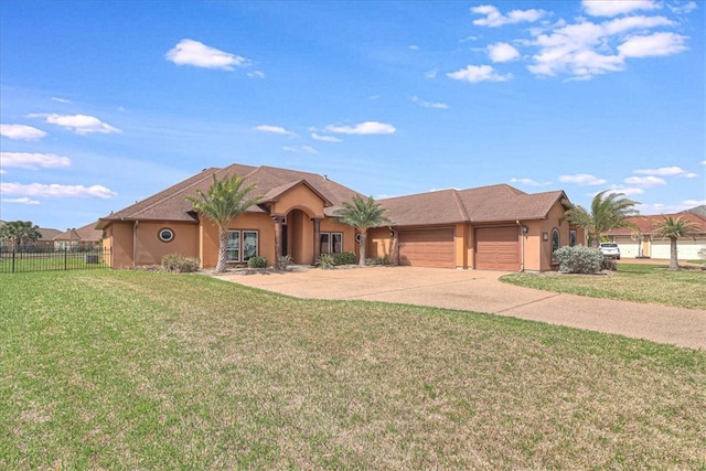 view of front of property featuring stucco siding, a front lawn, fence, concrete driveway, and a garage