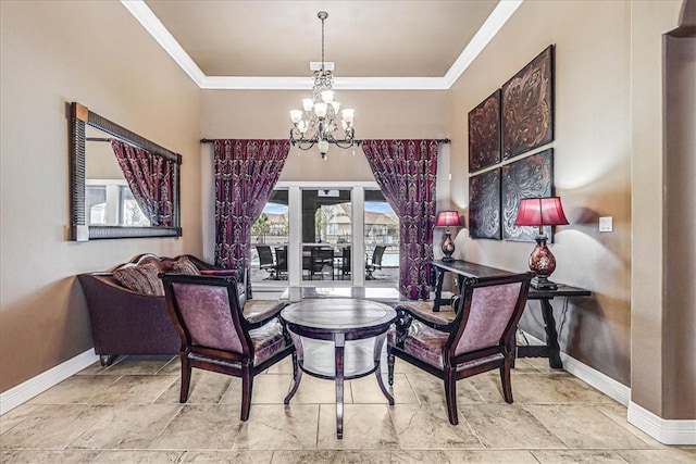 dining area featuring a chandelier, crown molding, and baseboards