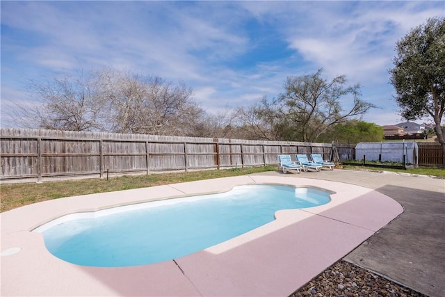 view of pool with a patio area and a fenced backyard