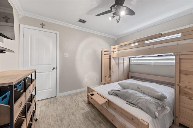 bedroom featuring ceiling fan, light wood-type flooring, and ornamental molding