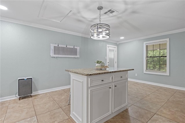 kitchen featuring white cabinets, decorative light fixtures, a kitchen island, and ornamental molding