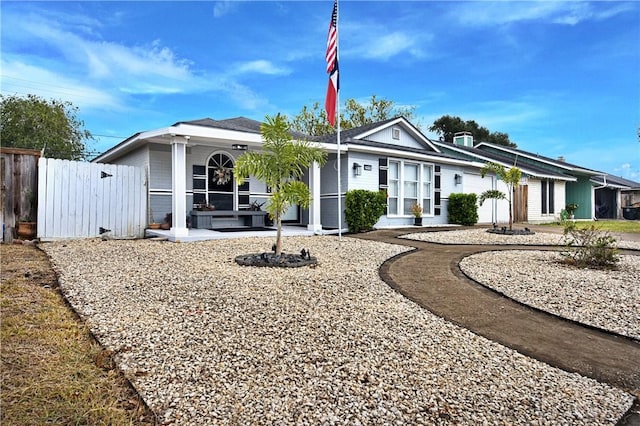 ranch-style house with covered porch