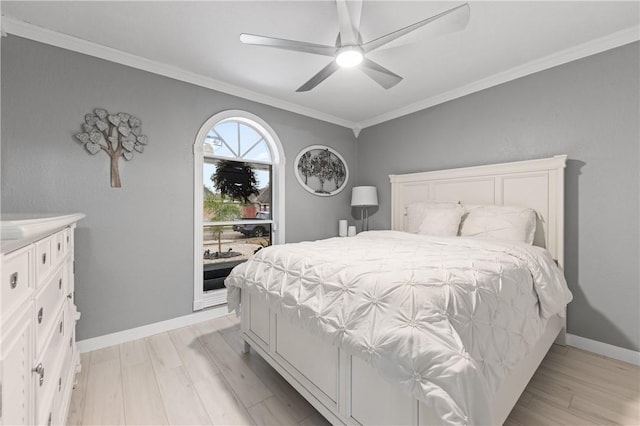 bedroom with ceiling fan, light hardwood / wood-style floors, and ornamental molding