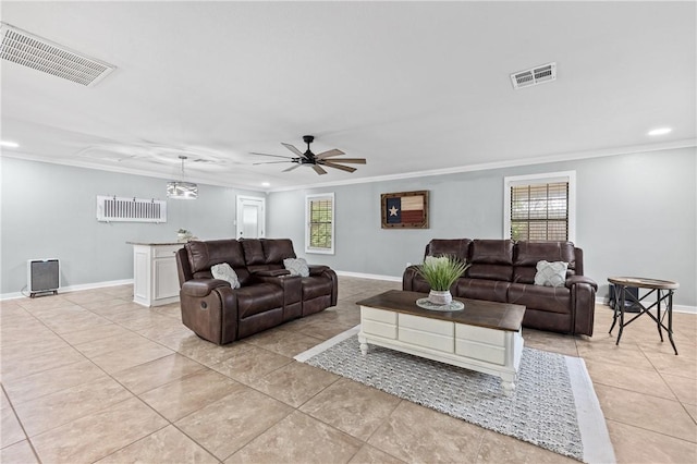 tiled living room with ceiling fan and ornamental molding