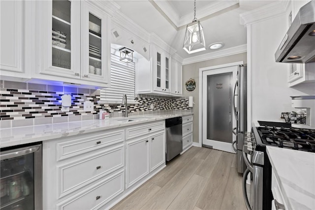 kitchen with wine cooler, white cabinetry, stainless steel appliances, and exhaust hood