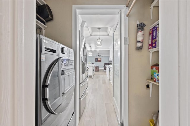 laundry room with light hardwood / wood-style floors and washer / dryer