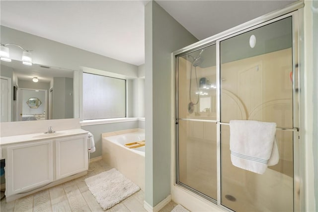 4442 Lake Superior Dr, Corpus Christi, TX 78413 - bathroom featuring a garden tub, vanity, and a shower stall