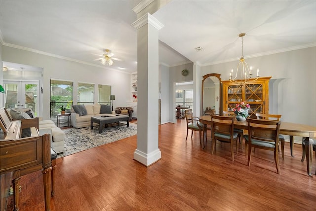 4442 Lake Superior Dr, Corpus Christi, TX 78413 - dining area featuring decorative columns, a chandelier, wood finished floors, ceiling fan, and ornamental molding