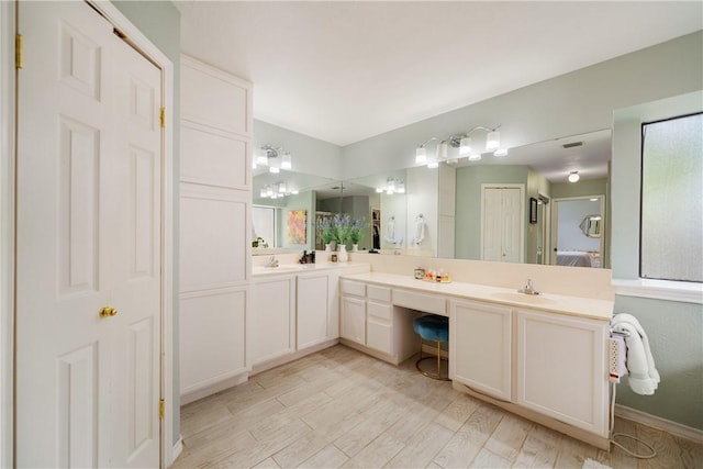 4442 Lake Superior Dr, Corpus Christi, TX 78413 - bathroom with double vanity and wood finished floors