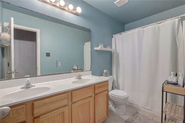 6517 Macarena Dr, Corpus Christi, TX 78414 - bathroom featuring visible vents, tile patterned flooring, toilet, and a sink