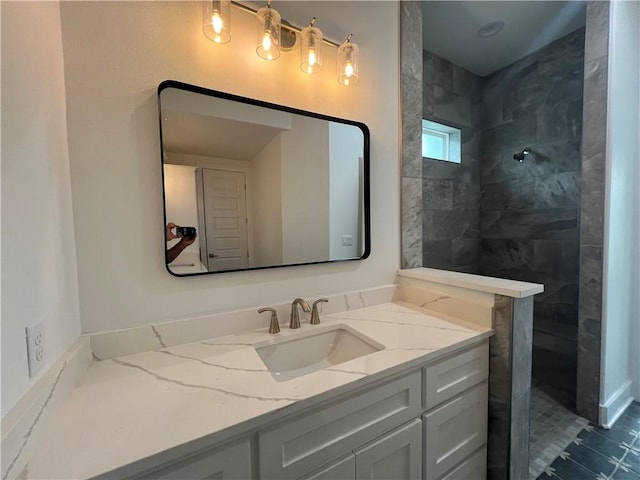 full bathroom with vanity and a walk in shower