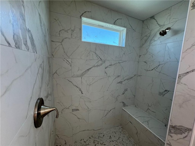 full bath with a marble finish shower