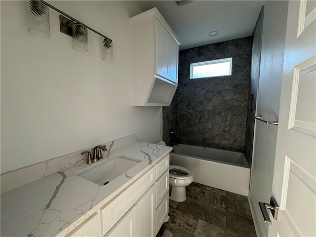 bathroom featuring vanity, shower / bathing tub combination, and toilet
