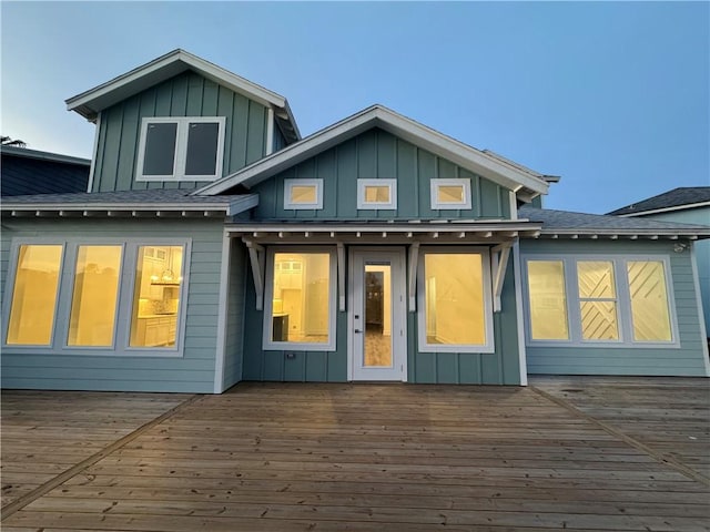 13741 Tajamar St, Corpus Christi, TX 78418 - rear view of property with board and batten siding and a deck