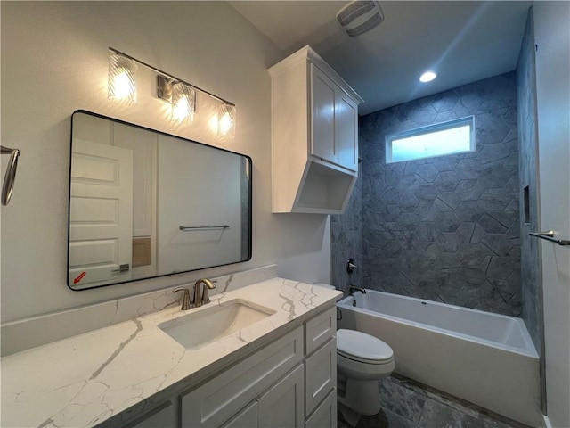 bathroom with toilet, bathtub / shower combination, and vanity