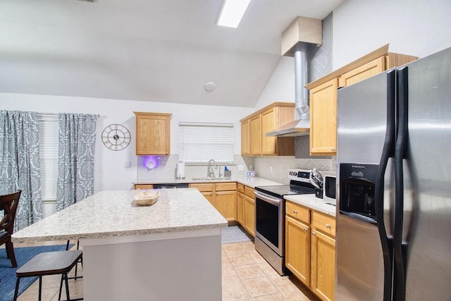 kitchen featuring vaulted ceiling, sink, a center island, stainless steel appliances, and wall chimney range hood