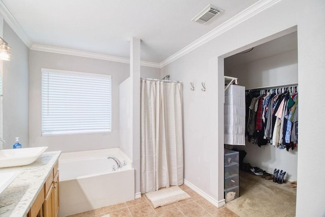 bathroom featuring tile patterned flooring, vanity, ornamental molding, and plus walk in shower