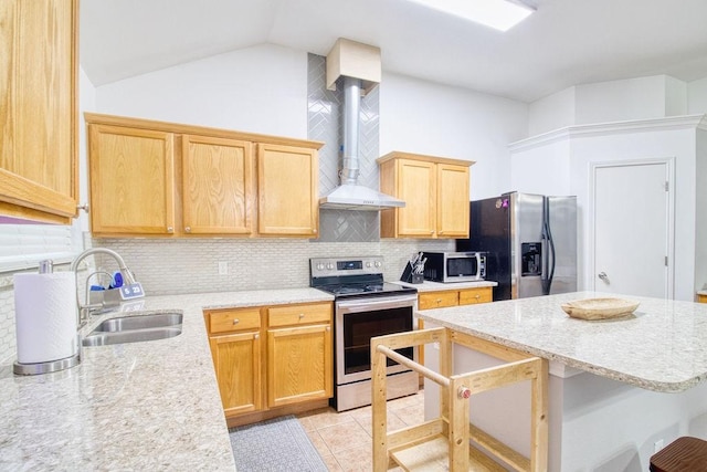 kitchen featuring light tile patterned flooring, sink, vaulted ceiling, appliances with stainless steel finishes, and wall chimney range hood