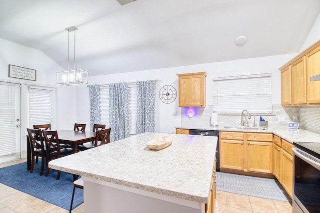 kitchen featuring lofted ceiling, sink, electric range, a kitchen island, and decorative light fixtures