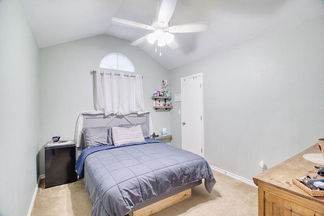 carpeted bedroom featuring lofted ceiling and ceiling fan