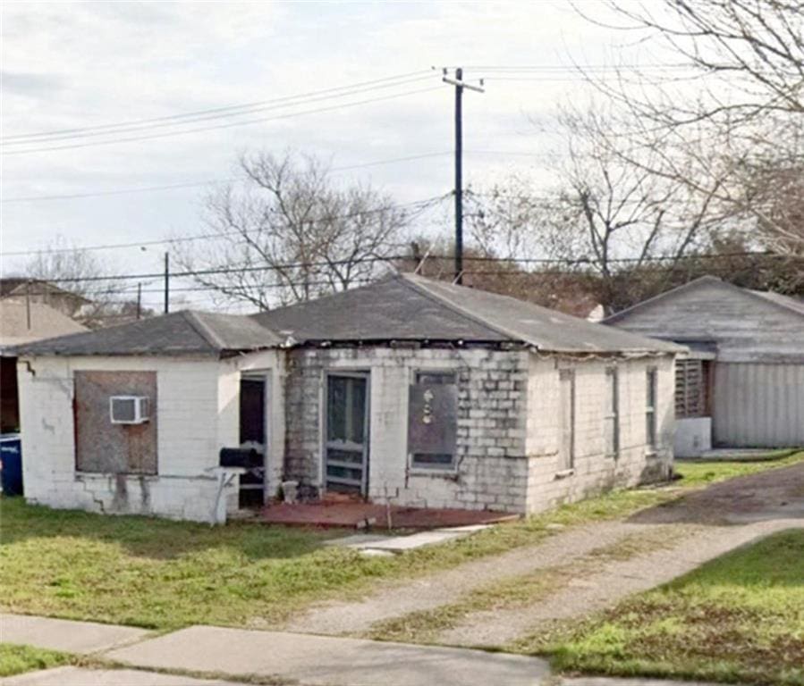 view of side of property with a yard