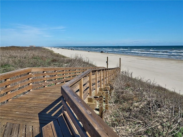 view of property's community featuring a view of the beach and a water view