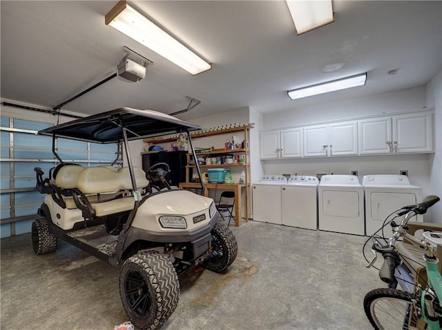 garage featuring washer and clothes dryer and a garage door opener