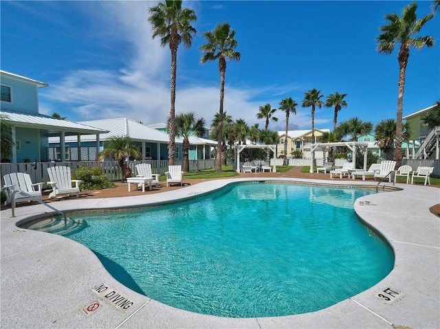 view of pool with a pergola and a patio