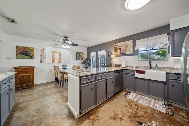 kitchen featuring sink, gray cabinets, kitchen peninsula, dishwasher, and decorative backsplash