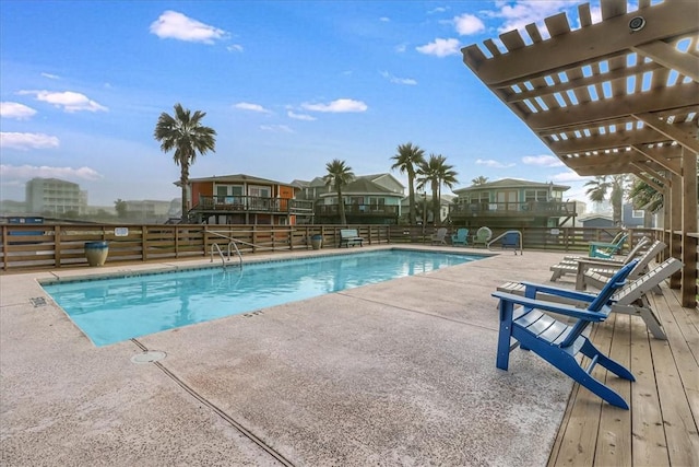 view of swimming pool with a pergola and a patio