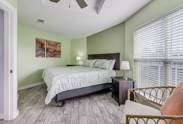 bedroom featuring ceiling fan and light hardwood / wood-style flooring