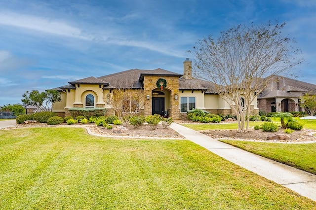 view of front of home with a front lawn