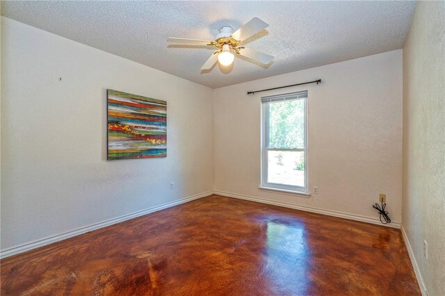 4102 Castle Valley Dr, Corpus Christi, TX 78410 - unfurnished room with finished concrete flooring, baseboards, a textured ceiling, and ceiling fan